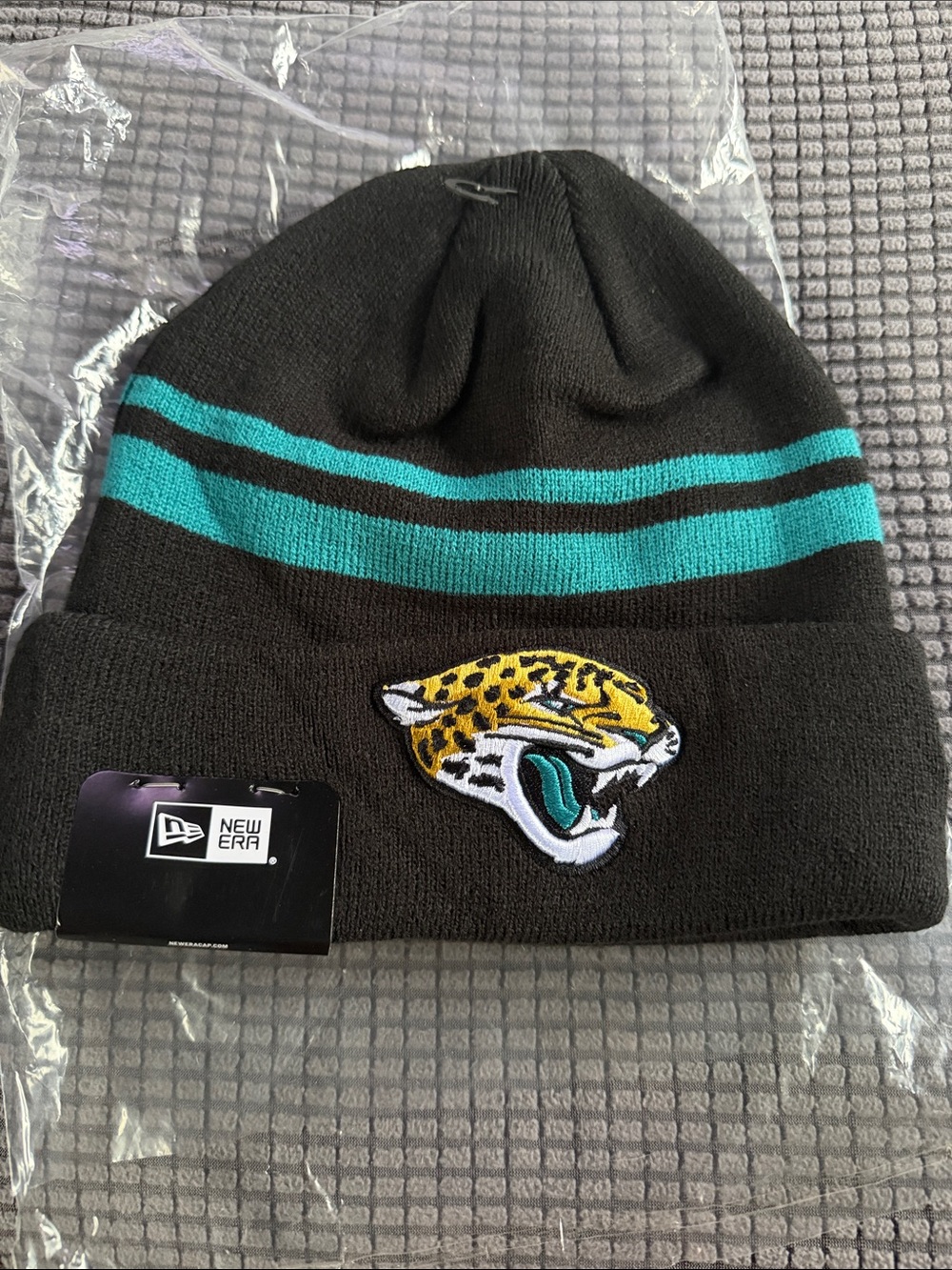 New Era Black Beanie with Teal Stripe and Embroidered Jaguar Patch
